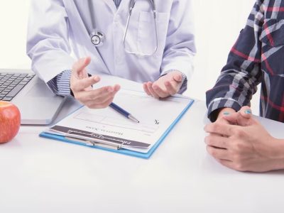 imgi_20_midsection-doctor-talking-patient-while-sitting-hospital_1048944-3626780